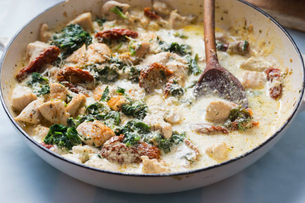 istock Creamy Tuscan chicken with sun dried tomatoes, spinach and parmesan 1284958713