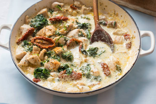 istock Creamy Tuscan chicken with sun dried tomatoes, spinach and parmesan 1284958806