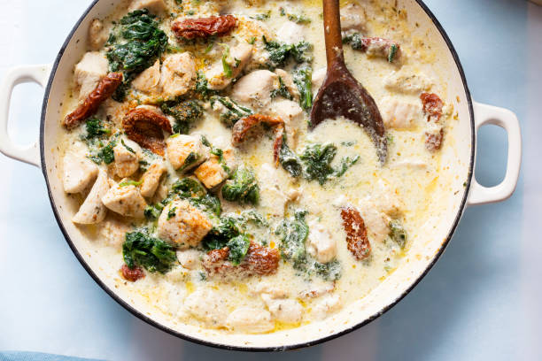 istock Creamy Tuscan chicken with sun dried tomatoes, spinach and parmesan 1284958894