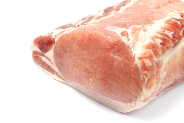 istock A large piece of raw pork meat closeup on a white background, isolate. 1284958902