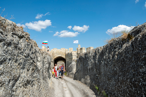 Ovech fortress, near Provadia town, Bulgaria - September 22, 2020:  Tourists at the main gate of the ancient fortress Ovech near Provadia town