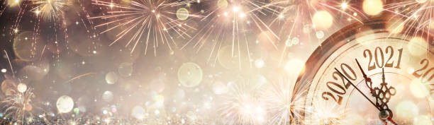 istock Happy New Year 2021 - Clock And Fireworks Waiting Midnight 1284960082