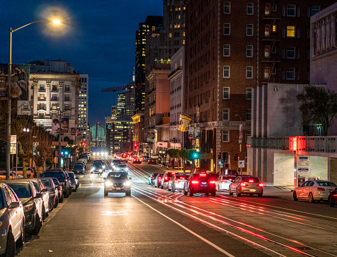 San Francisco, USA - Evening traffic in Lower Nob Hill, San Francisco, looking towards the Bay Bridge in the distance.