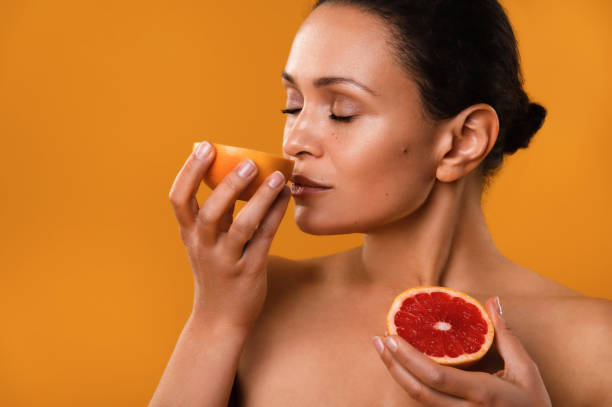 istock Portrait of Woman with Grapefruit 1284961130