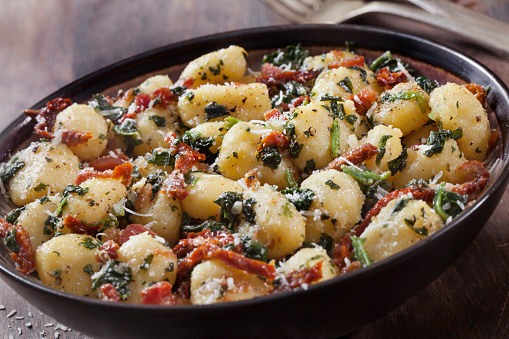 Gnocchi with Crispy Pancetta, Sun dried Tomatoes, Spinach and Parmesan Cheese in a Brown Butter Sauce