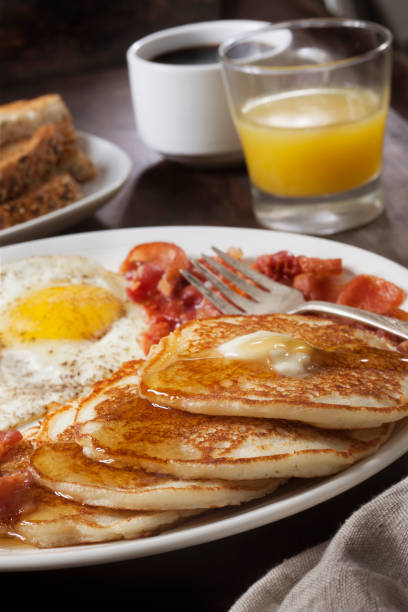 istock Grand Slam Breakfast with Pancakes, Bacon, Eggs, and Toast 1284963265