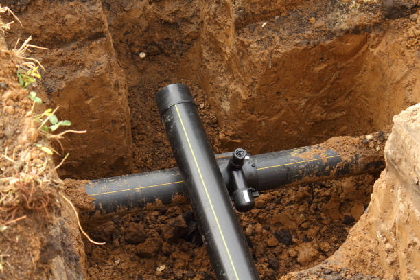 istock Extension of underground PVC water pipeline in pit 1284963418