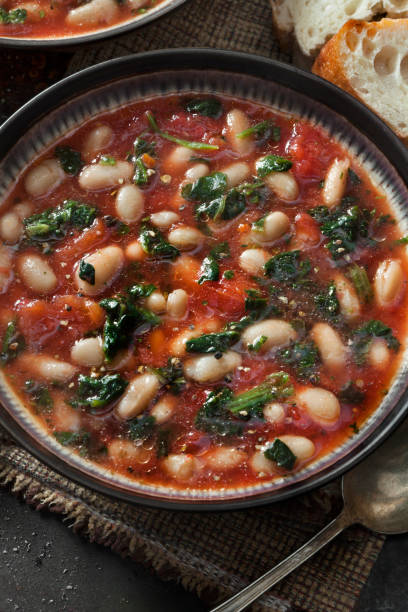 istock Italian White Bean Soup with Spinach and Carrots in a Tomato Broth 1284963511