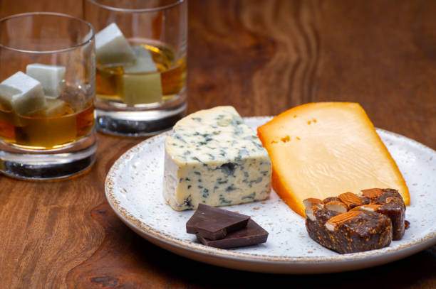 istock Tasting and pairing of different cheeses with strong alcoholic drinks, whisky, cognac or calvados 1284963686