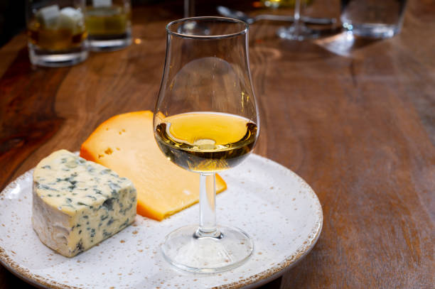 istock Tasting and pairing of different cheeses with strong alcoholic drinks, whisky, cognac or calvados 1284963688