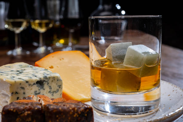 istock Tasting and pairing of different cheeses with strong alcoholic drinks, whisky, cognac or calvados 1284963692