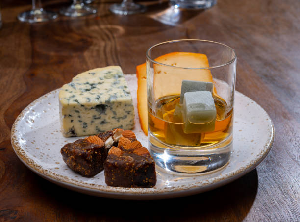 istock Tasting and pairing of different cheeses with strong alcoholic drinks, whisky, cognac or calvados 1284963702
