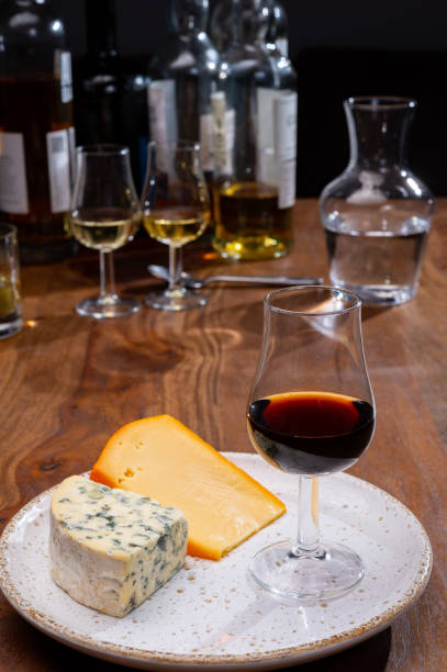 istock Tasting and pairing of different cheeses with strong alcoholic drinks, whisky, cognac or calvados 1284963704