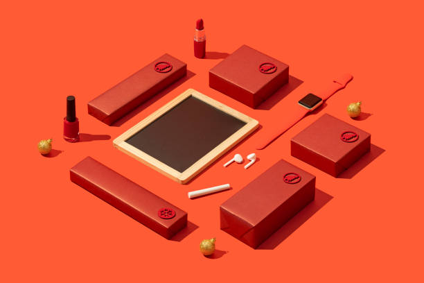 Blackboard mockup on red background with red gift boxes and makeup flat lay.