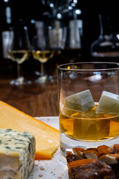 istock Tasting and pairing of different cheeses with strong alcoholic drinks, whisky, cognac or calvados 1284964438