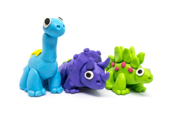 istock Play dough group Brachiosaurus, Triceratopson, Stegosaurus, on white background. Handmade clay plasticine 1284965528