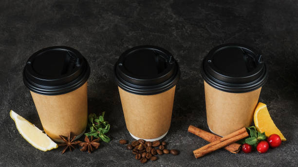 istock Christmas drinks in disposable cups. Tea with lemon and star anise, freshly brewed coffee and tea with cranberries and cinnamon. Hot drinks in winter. New Year's menu. Seasonal winter drinks. 1284965844