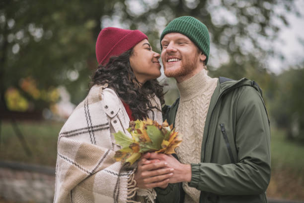 istock Man and woman having a date in autumn forest 1284966670