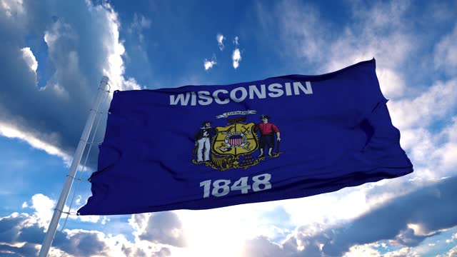 Wisconsin flag on a flagpole waving in the wind, blue sky background. 4K