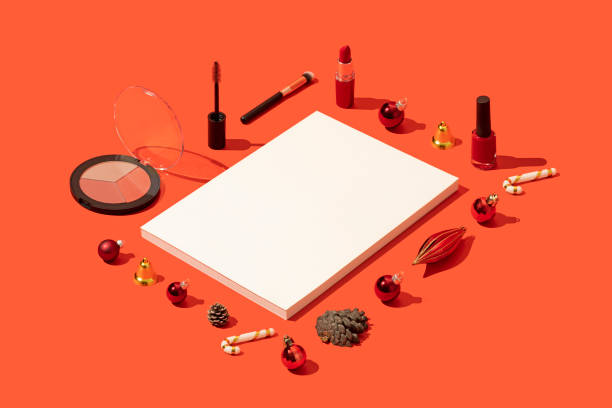 istock Christmas concept flat lay with magazine cover template and makeup on red background 1284968373