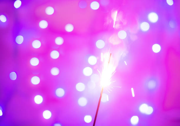 istock Background of festive sparklers on pink background. Th 1284970865