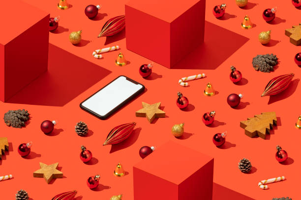 istock Christmas concept flat lay with smart phone mockup, template on red background 1284971682