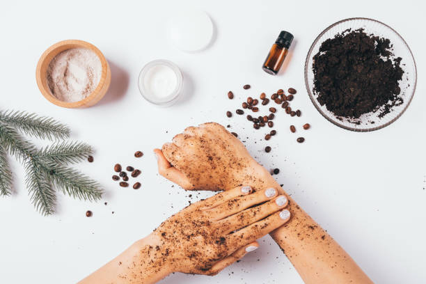 istock Flat lay female hands making peeling procedure with homemade cosmetic coffee scrub 1284973122