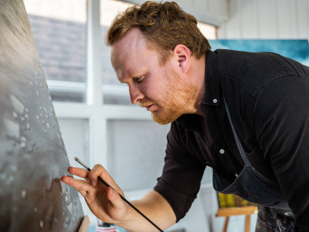 istock Man painting art in his studio 1284974294