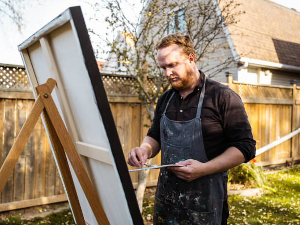 istock Man painting art in the backyard 1284974320