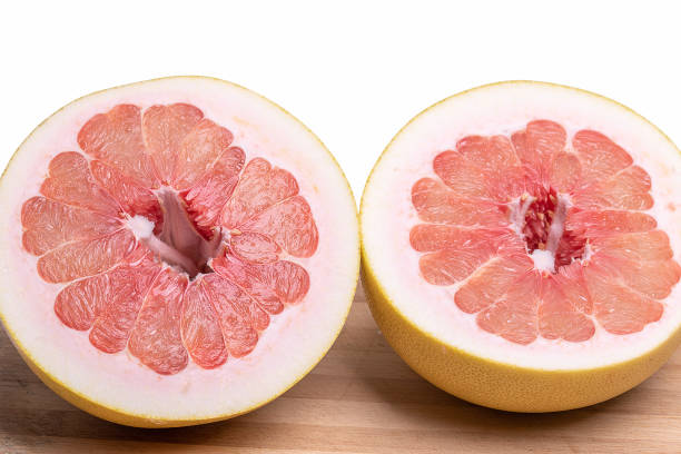 istock Fresh juicy orange pomelo sliced in two halfs 1284975682