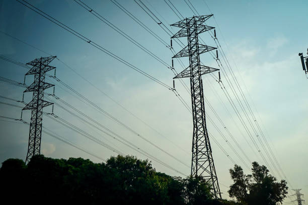 istock Power pole on a street dark 1284976657
