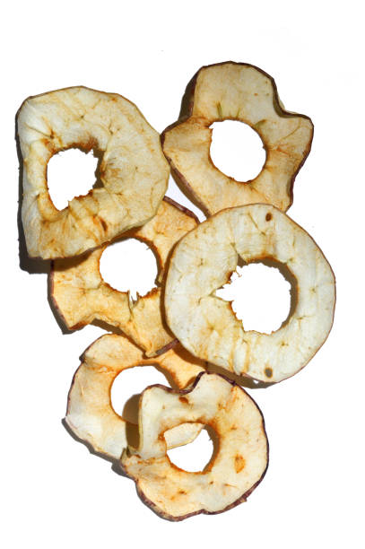 istock 6 slices of dried apples on a white background. 1284976689