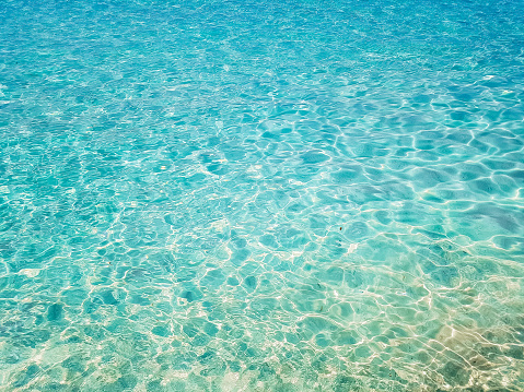 Clear turquoise sea water on Maldives, close up.