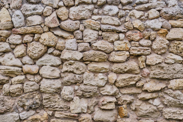 istock Texture of a very ancient stone wall 1284979178