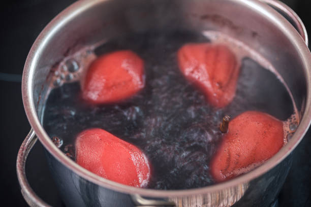 istock Preparing poached pears in red wine for the holidays at home 1284980159