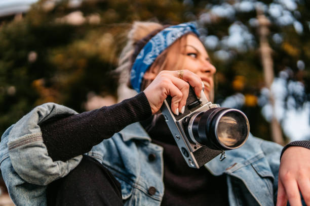 Beautiful woman with retro camera