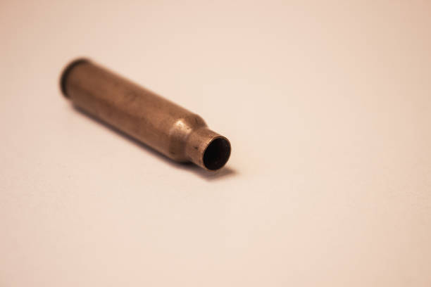 istock Bullet case. Bullet case isolated on white background. Gun bullet 1284982217