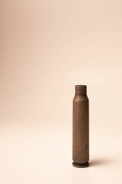 istock Bullet case. Bullet case isolated on white background. Gun bullet 1284982787