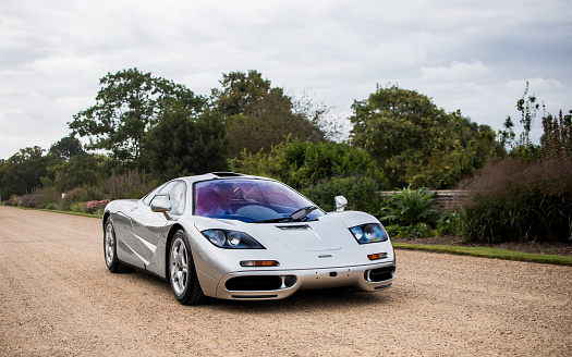London, United Kingdom September 6, 2019: Mclaren F1 Chassis 063 fully restored by MSO driving through the grounds of Hampton Court Palace during a Concours event.