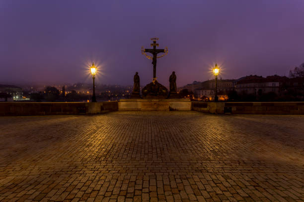 Autumn dawn in historic Prague at Charles Bridge over the Vltava River. Prague, UNESCO monument, Czech Republic