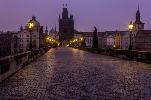 Autumn dawn in historic Prague at Charles Bridge over the Vltava River. Prague, UNESCO monument, Czech Republic