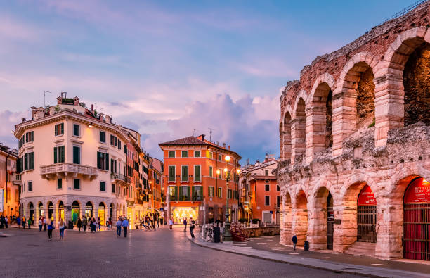 Night view of the Roman Arena and Piazza Bra in Verona. Verona / Italy - May 24 2018: Night view of the Roman Arena and Piazza Bra. The Arena is still in use today and is famous for the large-scale opera performances given there. verona opera stock pictures, royalty-free photos & images
