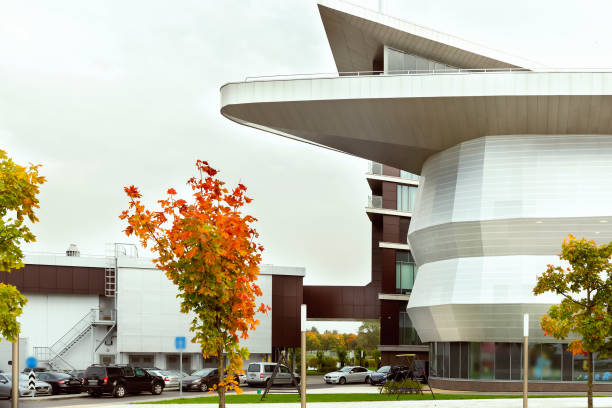 istock Parking in front of an office, modern building 1284986436