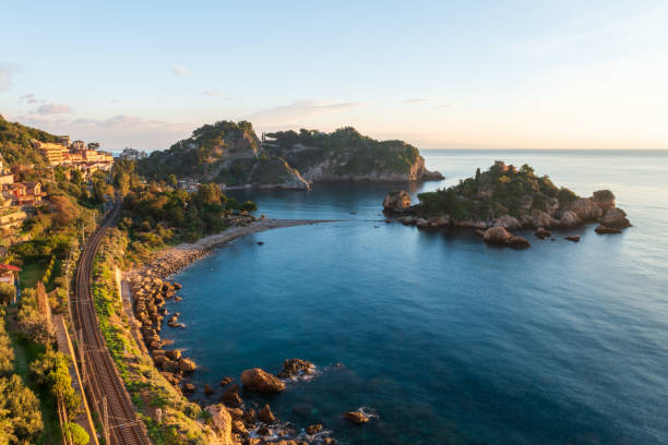 Isola Bella, Taromina - Sicily A view of the coast along Isola Bella, with the railway on the left isola bella taormina stock pictures, royalty-free photos & images