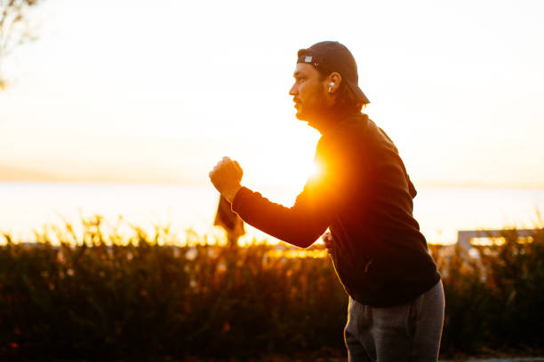 istock Young man running on the natural park 1284988591