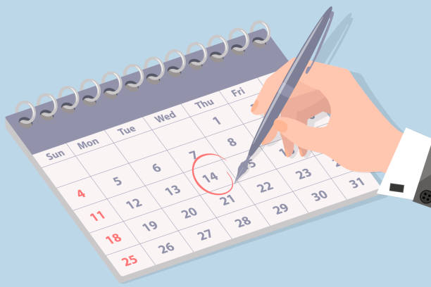 istock The hand of a businessman making notes in the calenda 1284990848