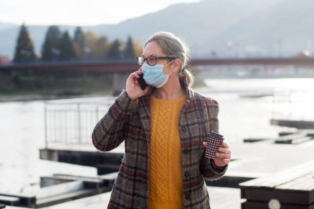 istock woman wearing a face mask 1284991055