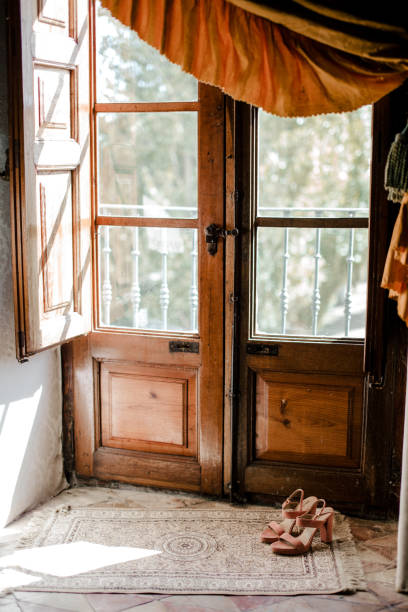 istock Pink shoes in the window 1284992934