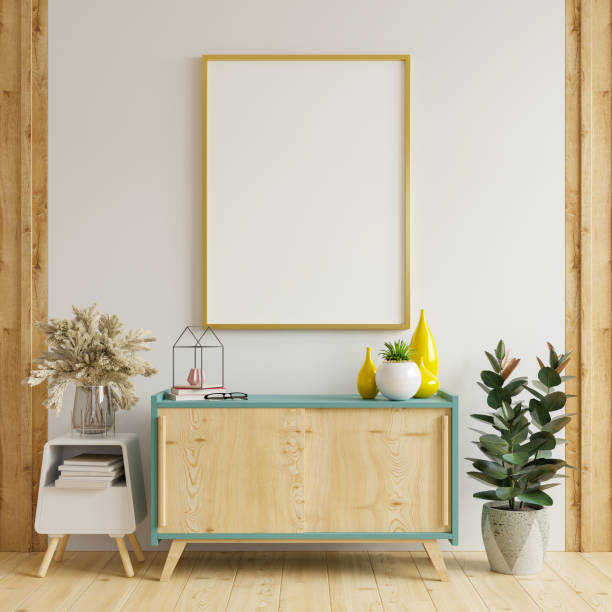 istock Mock up poster frame on cabinet in interior. 1284996371