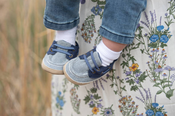 Baby boy feet in blue shoes